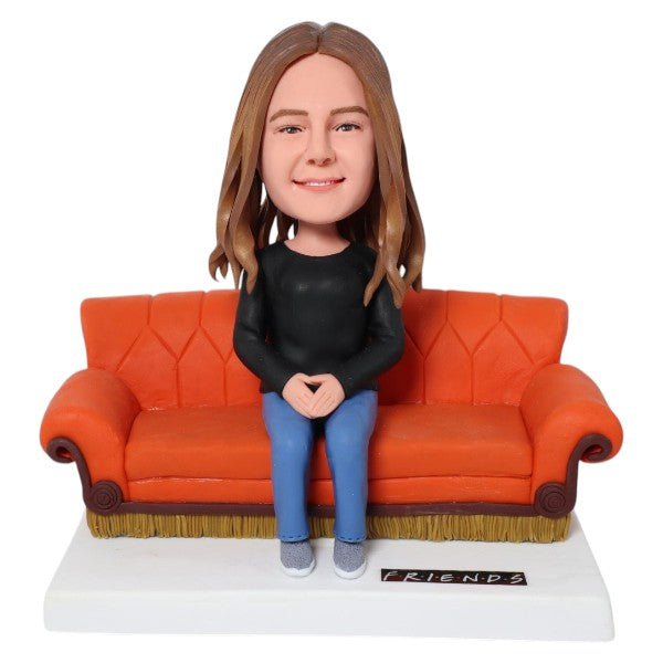 Custom Bobblehead sitting on Friends Central Perk orange couch sofa