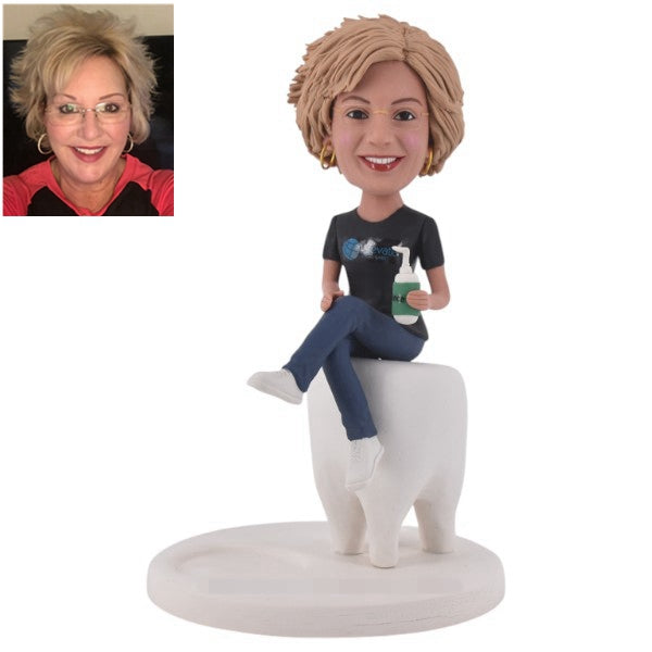 Dentist bobblehead Custom female siting on big tooth