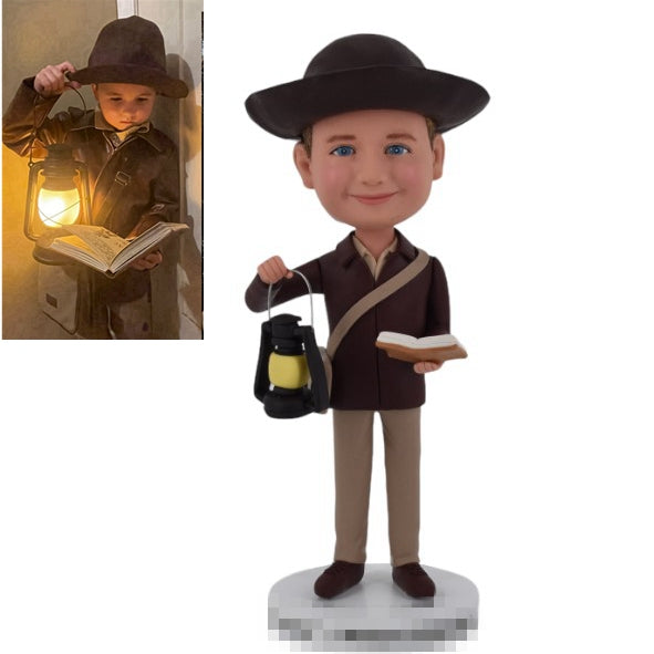 Custom Bobblehead holding Lantern and Book