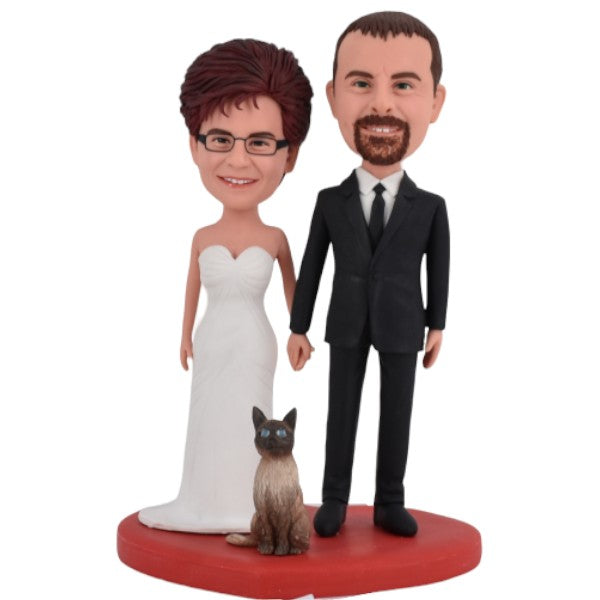 Groom and bride bobblehead cake topper from photos