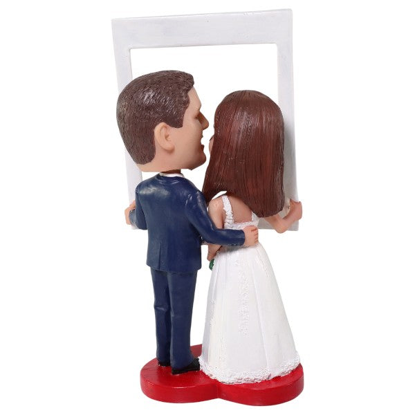 Custom Wedding Bobblehead holding photo frame