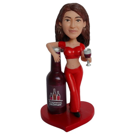 Custom beer girl bobblehead leaning on a beer bottle