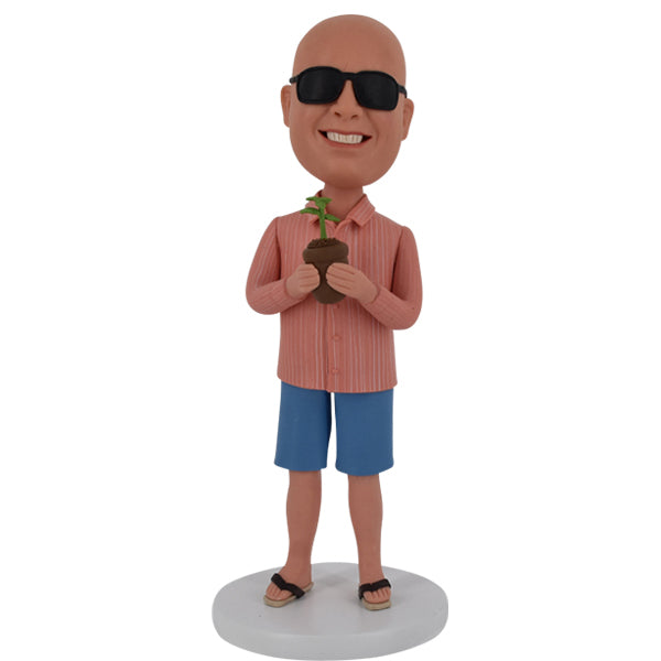 Custom Bobble Head holding plant