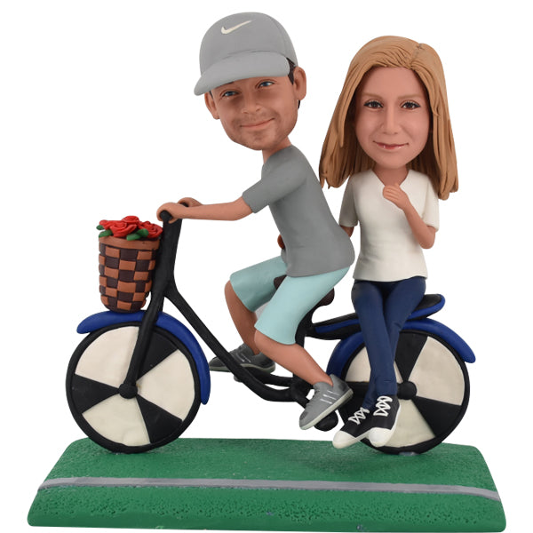 Couple Bobblehead on bike