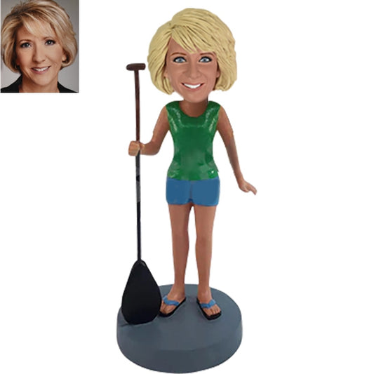 Custom Bobblehead holding a paddle board surfing water sports